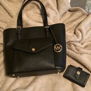 Black Michael Kors purse and mini wallet.